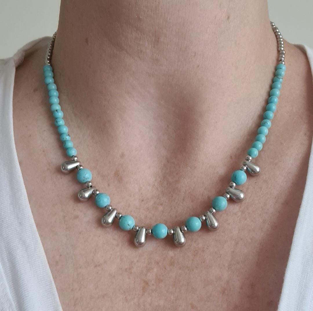 Even Cowgirls Get the Blues genuine turquoise and stainless steel teardrop beaded necklace.