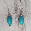 Short Round gold crackle turquoise beaded dangle earrings.