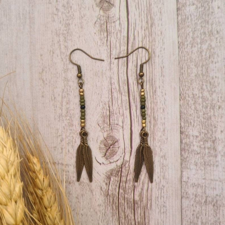 American West beaded feather drop earrings.