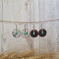 High Noon genuine cowhide earrings with natural turquoise bead detail.