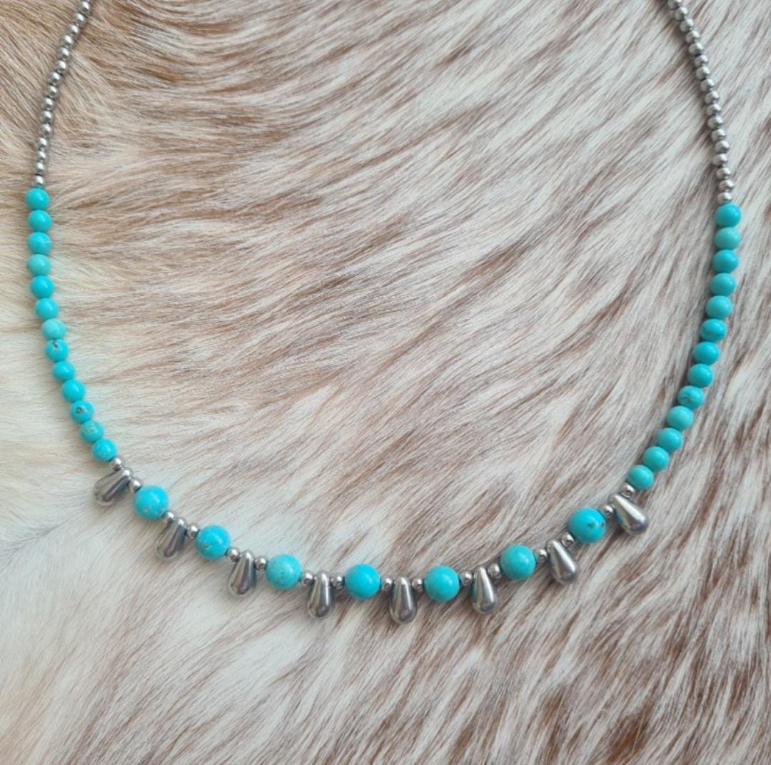 Even Cowgirls Get the Blues genuine turquoise and stainless steel teardrop beaded necklace.
