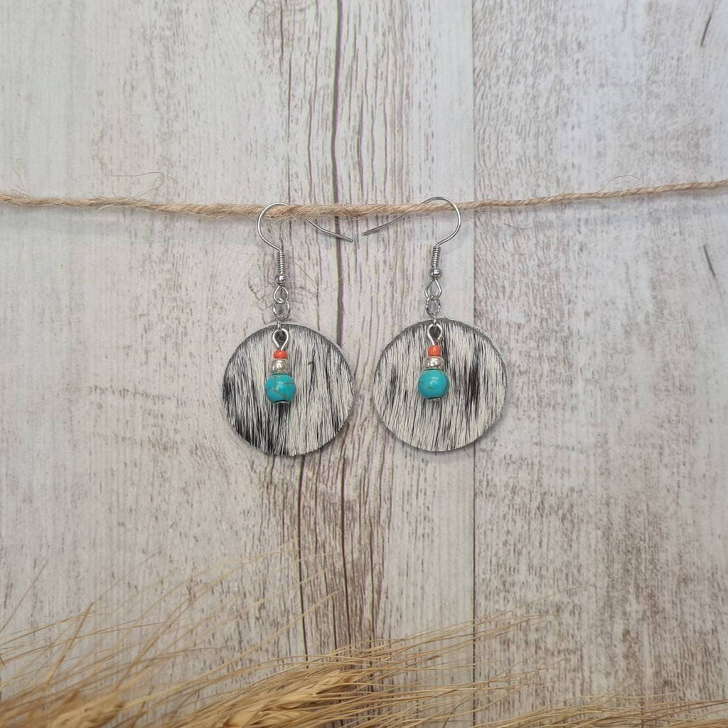 High Noon genuine cowhide earrings with natural turquoise bead detail.