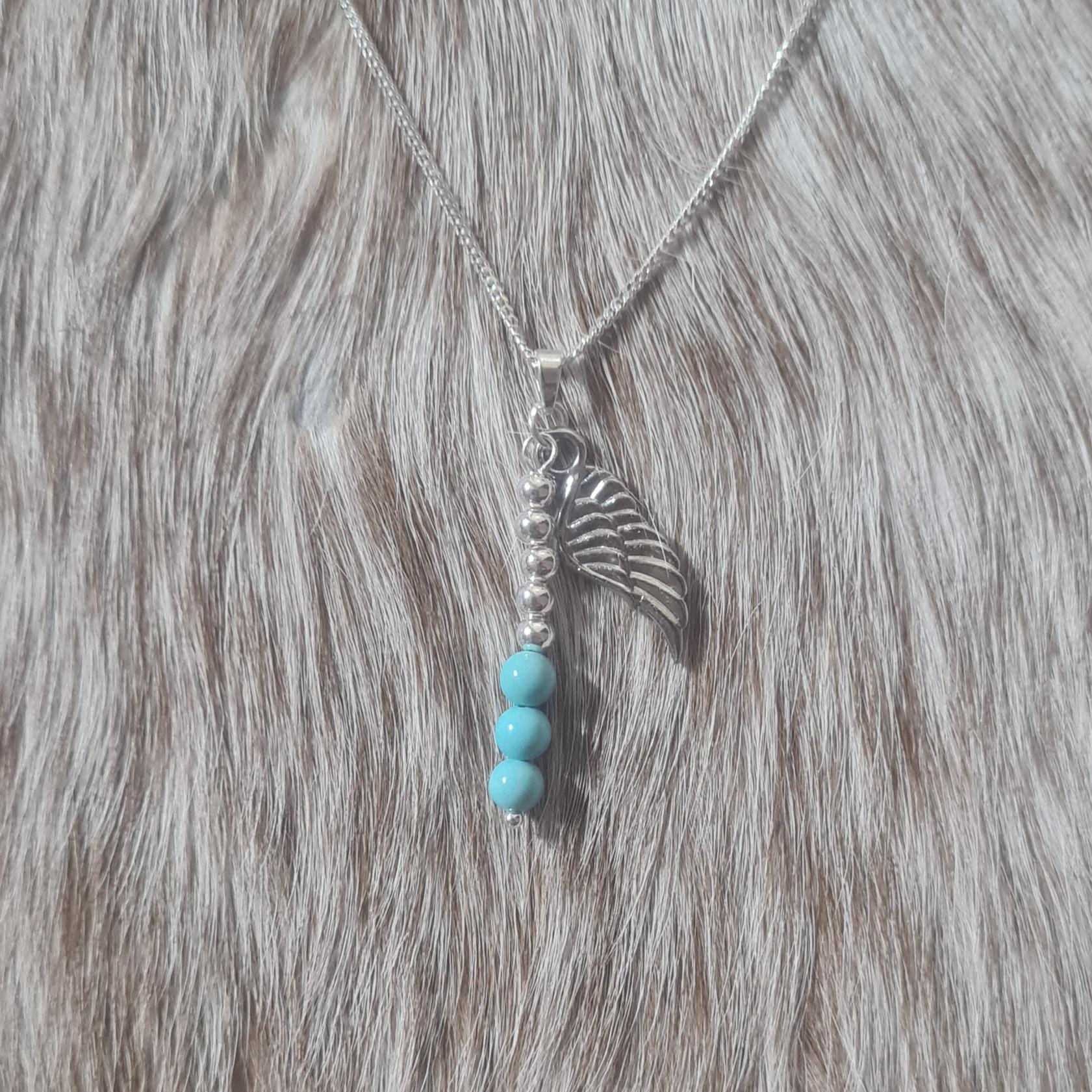 More Than Angels sterling silver and genuine turquoise Angelman Syndrome Awareness necklace.