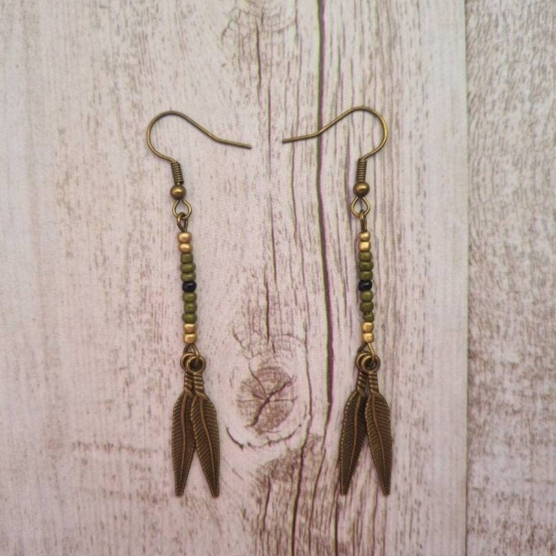 American West beaded feather drop earrings.