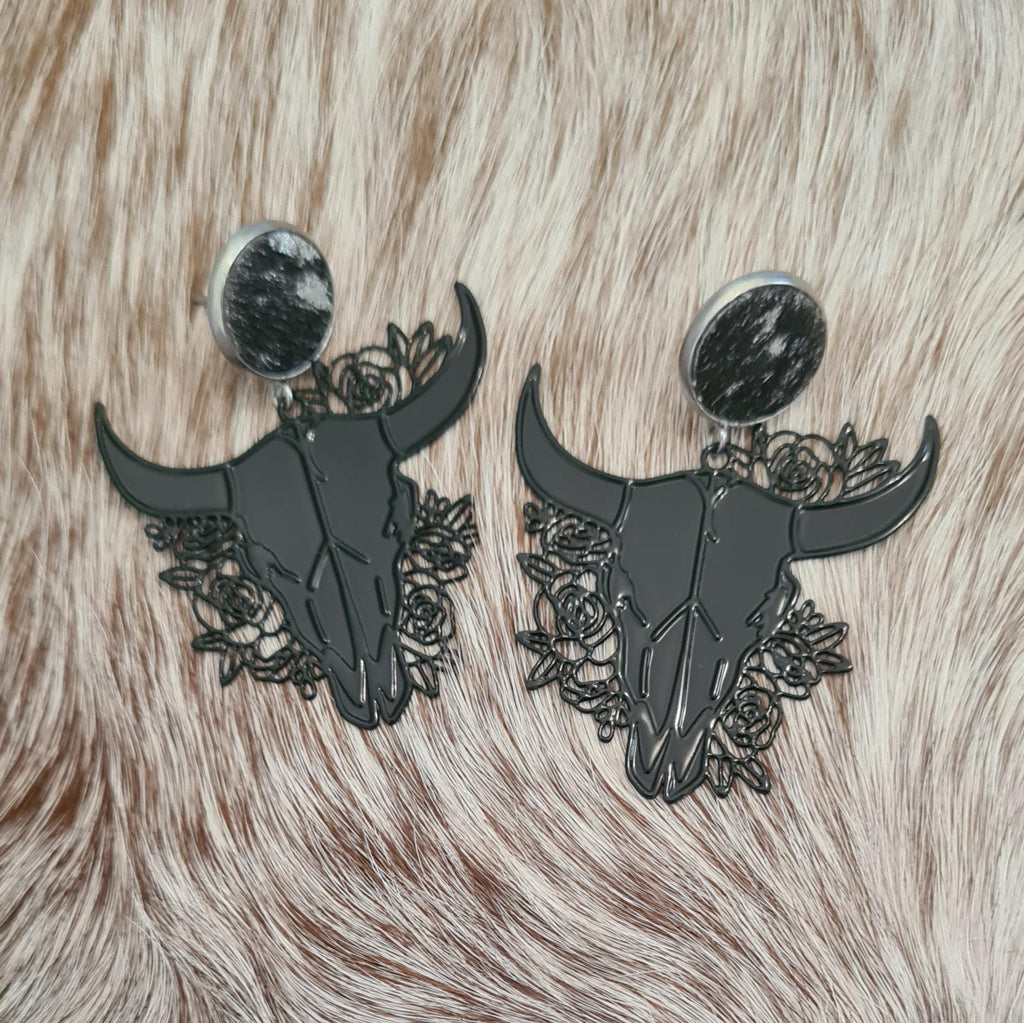 Rodeo Nights genuine cowhide studs with floral filigree steer skulls.