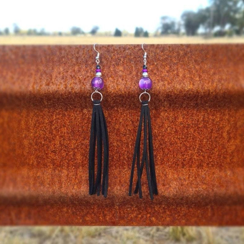 Sweetheart of the Rodeo long dangle amethyst earrings.