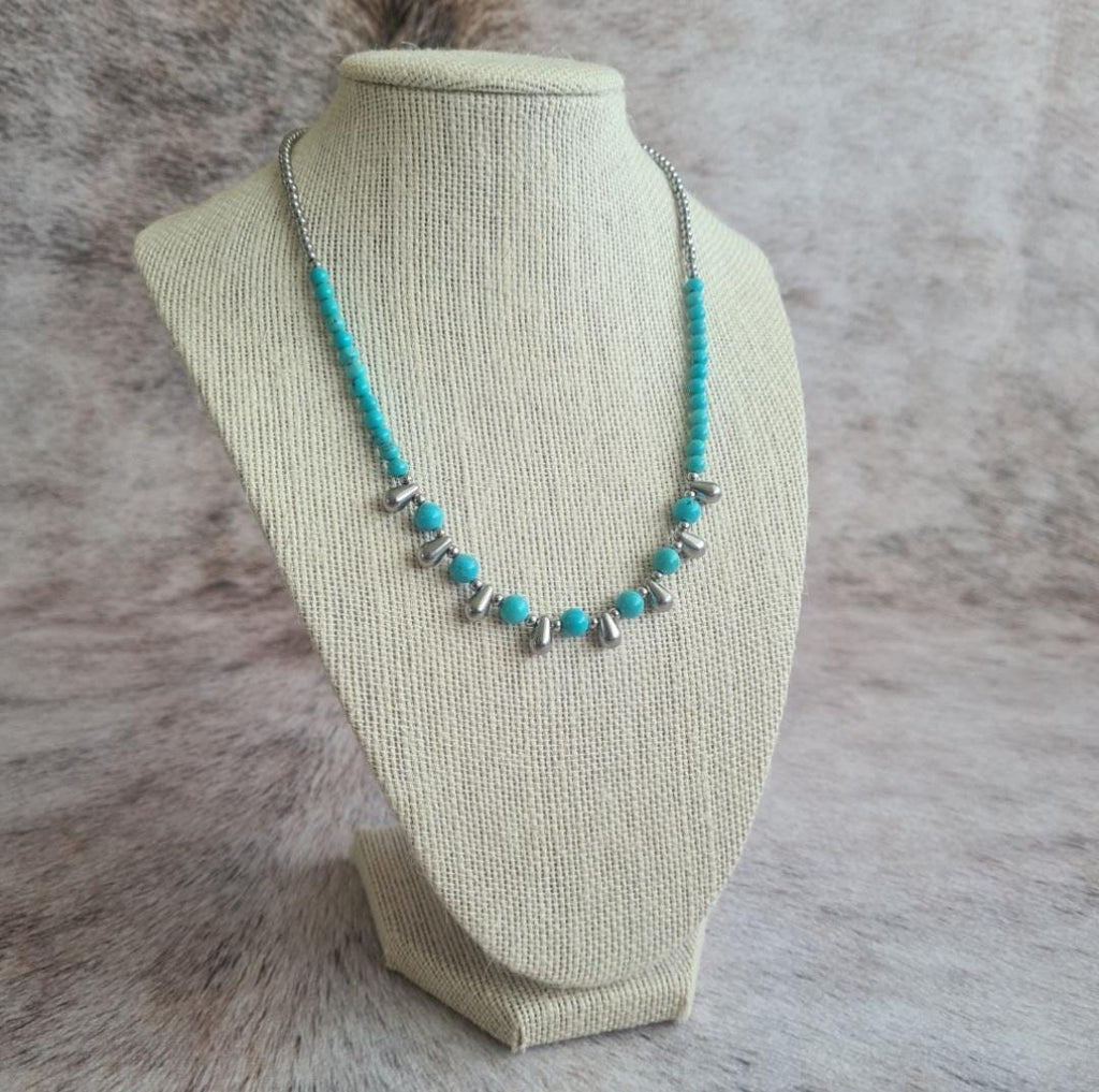 Even Cowgirls Get the Blues genuine turquoise and stainless steel teardrop beaded necklace.