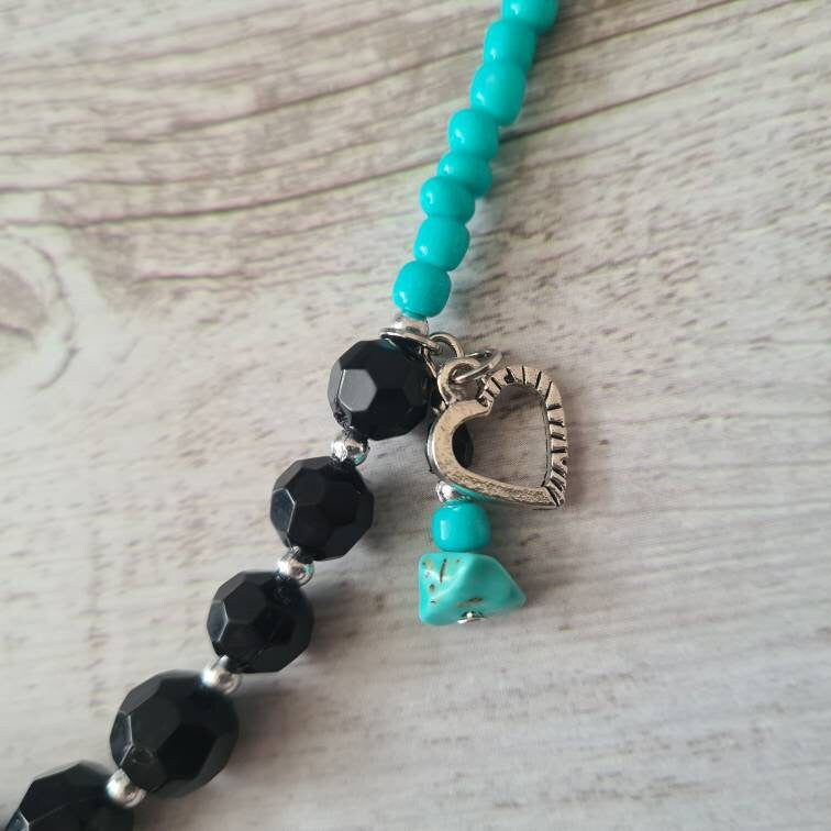Cross My Heart beaded necklace with turquoise chip and heart charm.