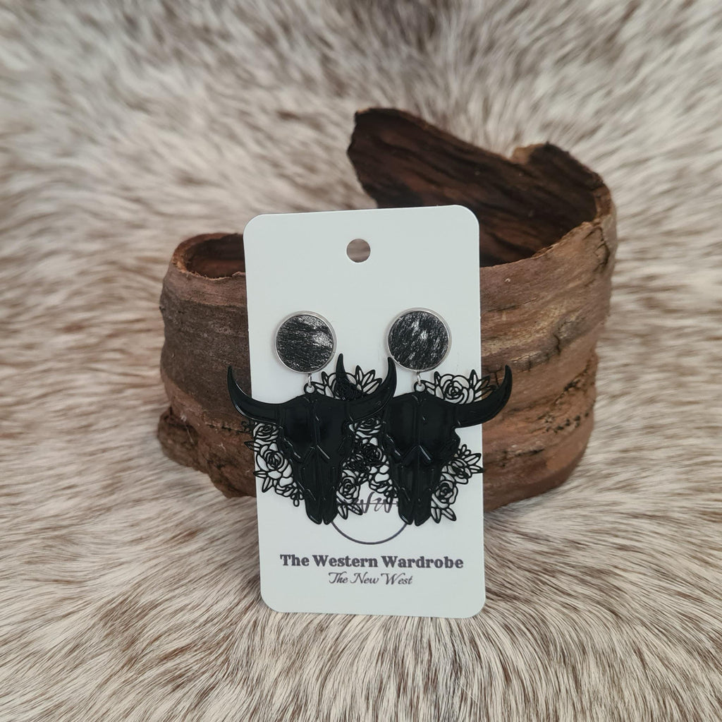 Rodeo Nights genuine cowhide studs with floral filigree steer skulls.