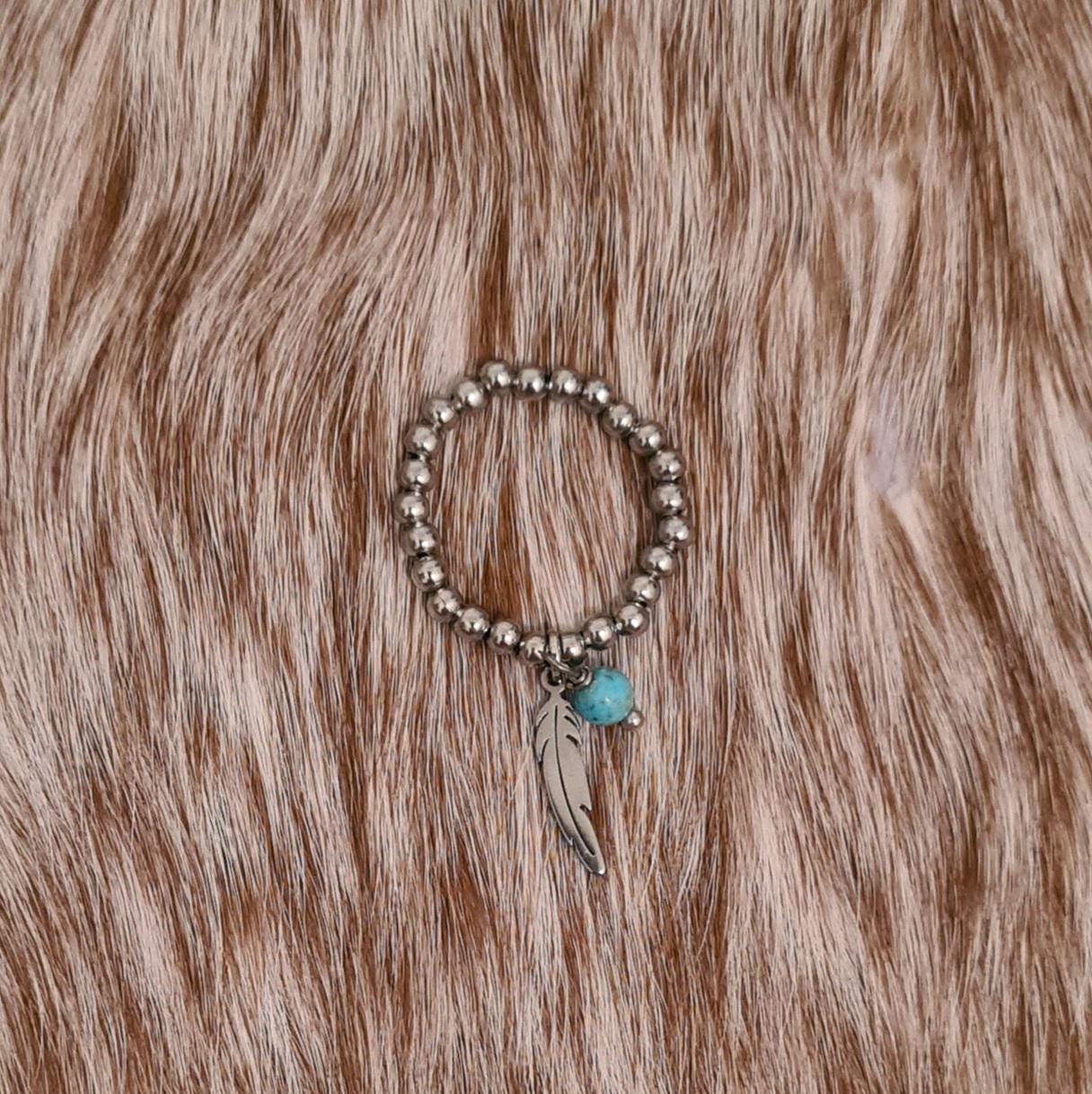 Fly free stainless steel beaded ring with genuine turquoise and stainless steel feather charms.