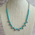 Even Cowgirls Get the Blues genuine turquoise and stainless steel teardrop beaded necklace.