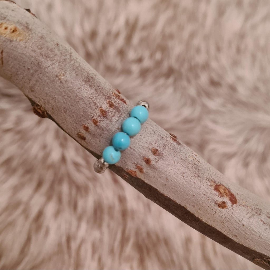Buffalo River genuine turquoise and stainless steel beaded ring.