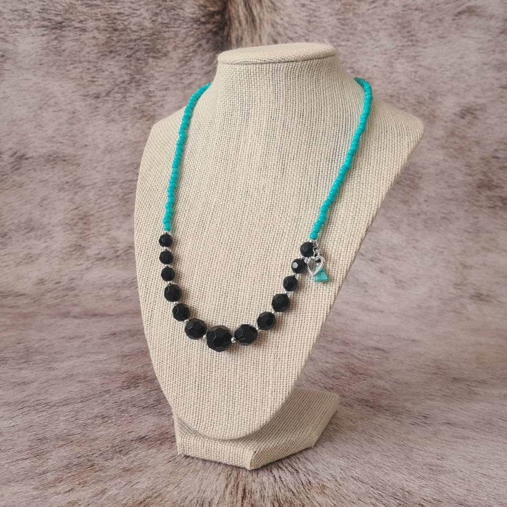 Cross My Heart beaded necklace with turquoise chip and heart charm.