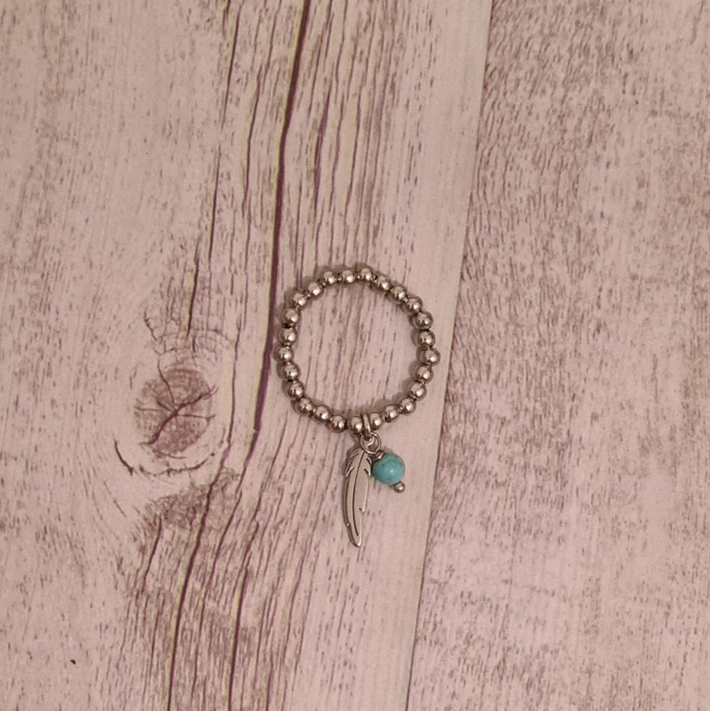 Fly free stainless steel beaded ring with genuine turquoise and stainless steel feather charms.