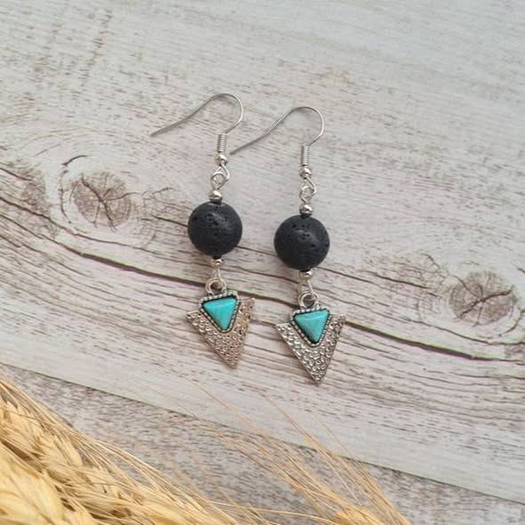 Wanderer arrowhead earrings with natural lava stone.