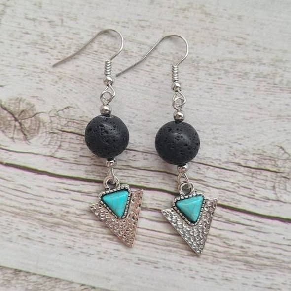 Wanderer arrowhead earrings with natural lava stone.